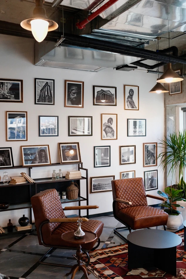 A wall of art prints in a living room